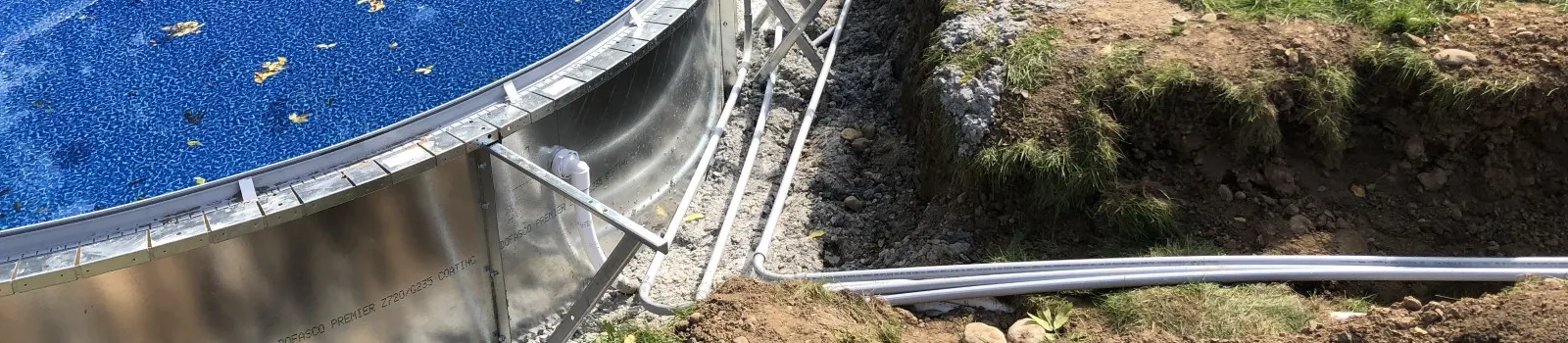 Electrical conduit run beside a new above-ground swimming pool
