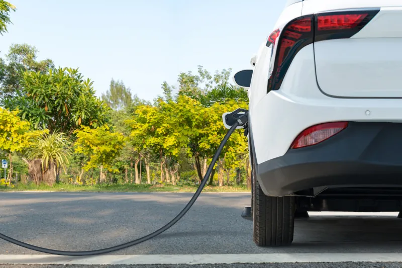 EV Charger plugged into a white car
